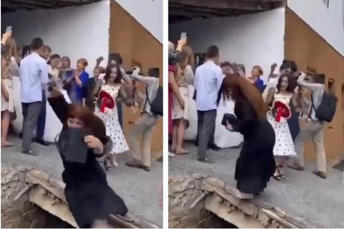 في احدى الدول ..شاهد سقوط امرأة في بالوعة أثناء تصويرها حفل زفاف بهاتفها
