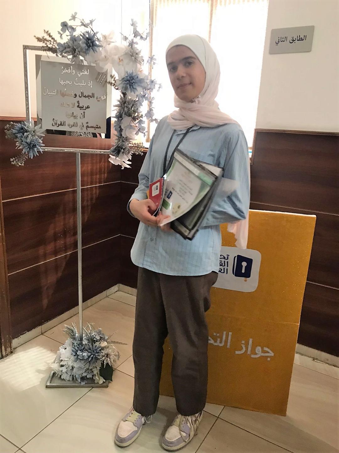 طالبة مدارس النظم الحديثة ليلاس بني مرجه تأهلت وانتقلت للتنافس إلى مستوى الإقليم في مسابقة تحدي القراءة العربي