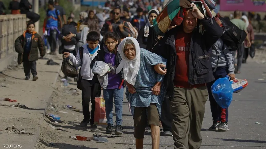 صورة حول : صور الألم: جوائز تكرم رويترز لتوثيق مأساة "حرب غزة" "التغريبة الغزية" إلى الجنوب ونزوح من الشمال